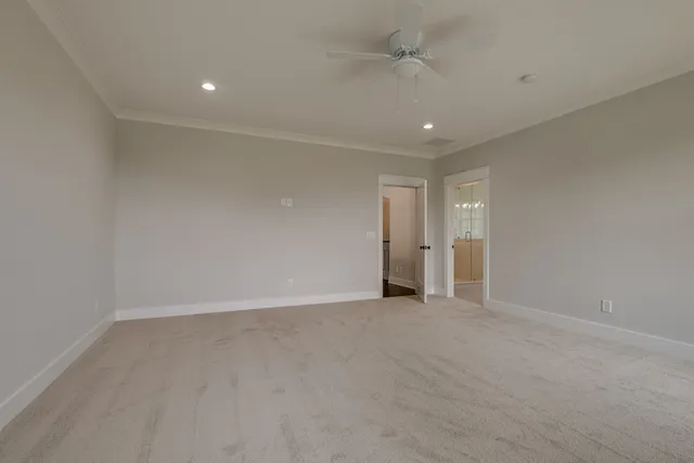 a view of an empty room with a bathroom
