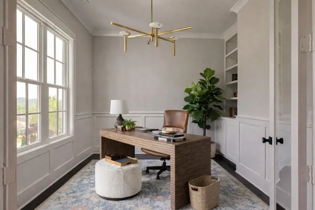 a workspace with furniture and a window