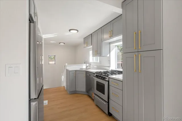 a kitchen with a stove and a refrigerator