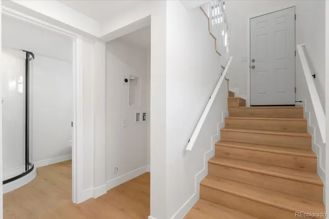 a view of entryway with wooden floor