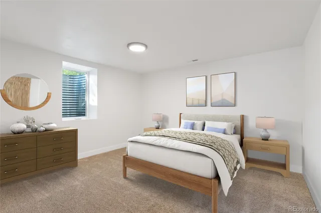 a bedroom with a bed dresser and a window