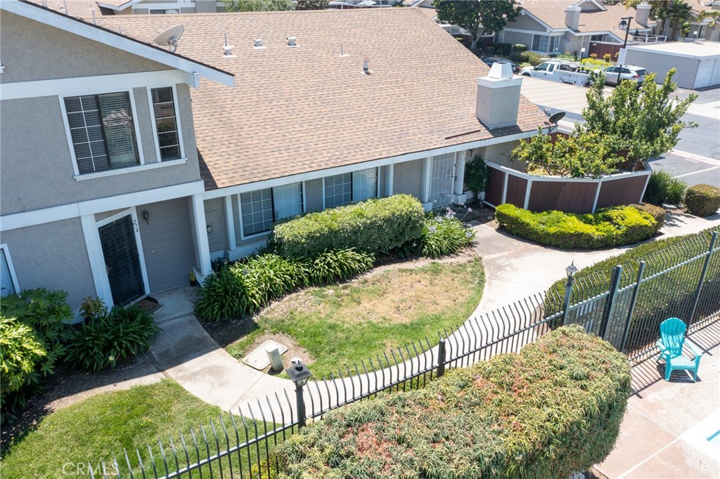 274 Riverview Way Oceanside, CA 92057 - Photo 6 of 6 a view of a house with wooden fence next to a yard