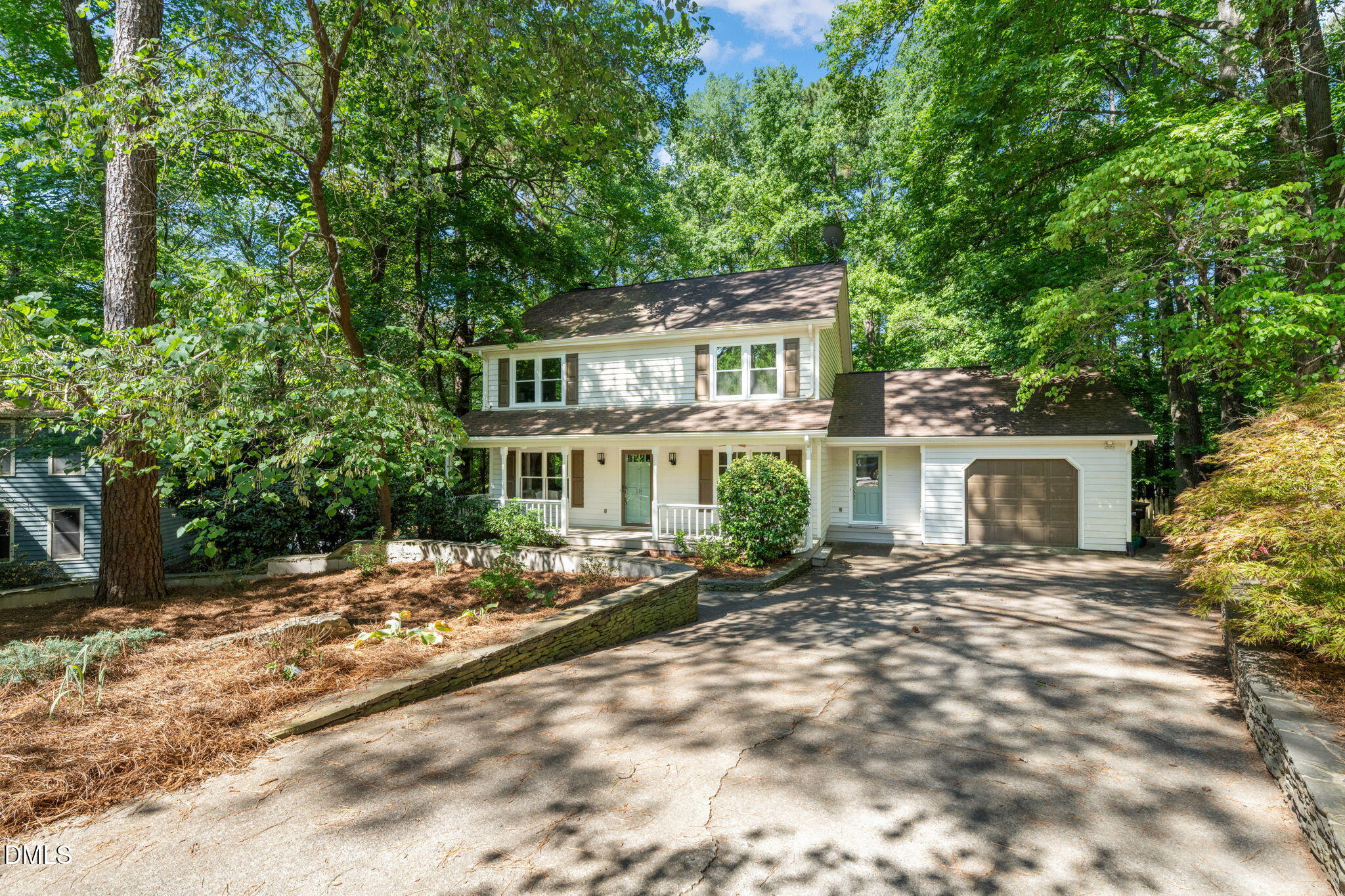 18 Strawberry Ridge Lane Durham, NC 27713 - Photo 51 of 59 a view of a house with a tree in front of it