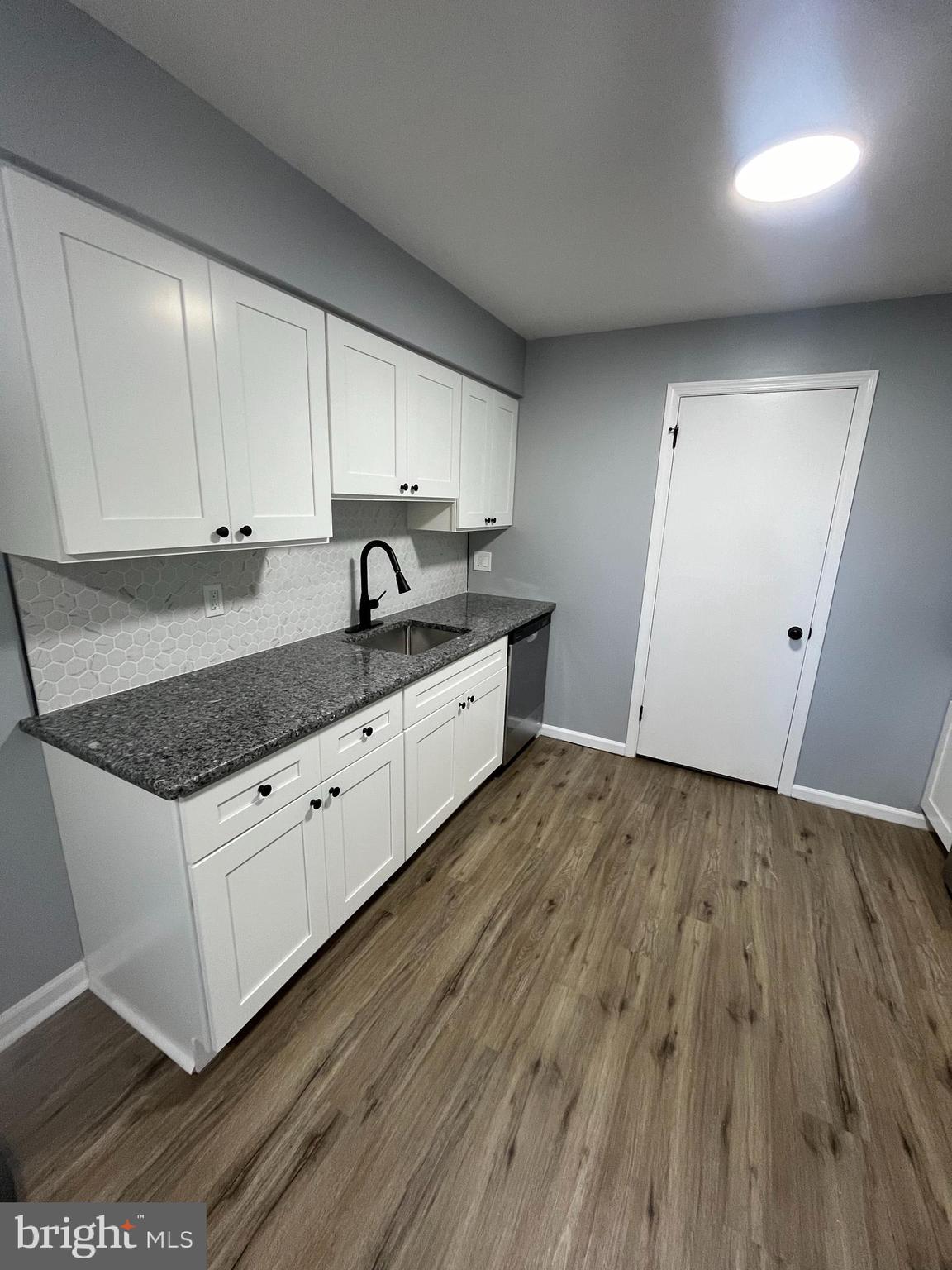 612 North Shady Retreat Road, Unit 14 Doylestown, PA 18901 - Photo 15 of 22 a kitchen with granite countertop a sink and cabinets