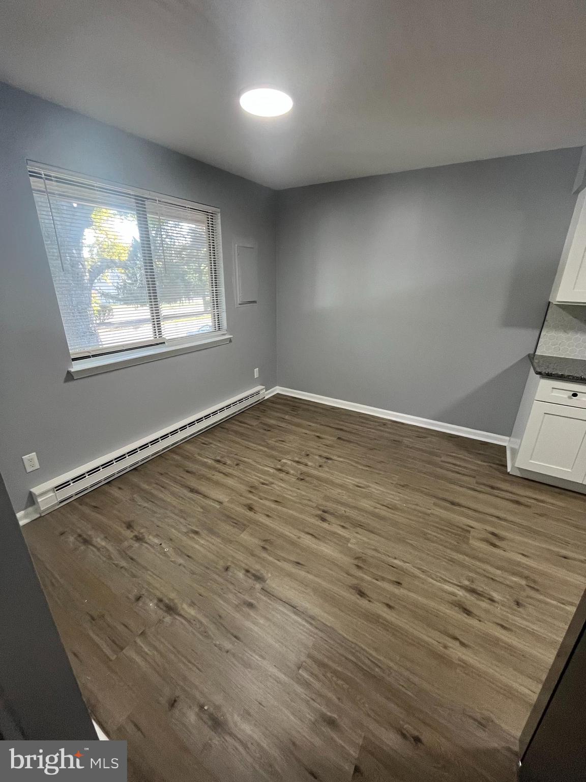 612 North Shady Retreat Road, Unit 14 Doylestown, PA 18901 - Photo 16 of 22 an empty room with wooden floor and windows