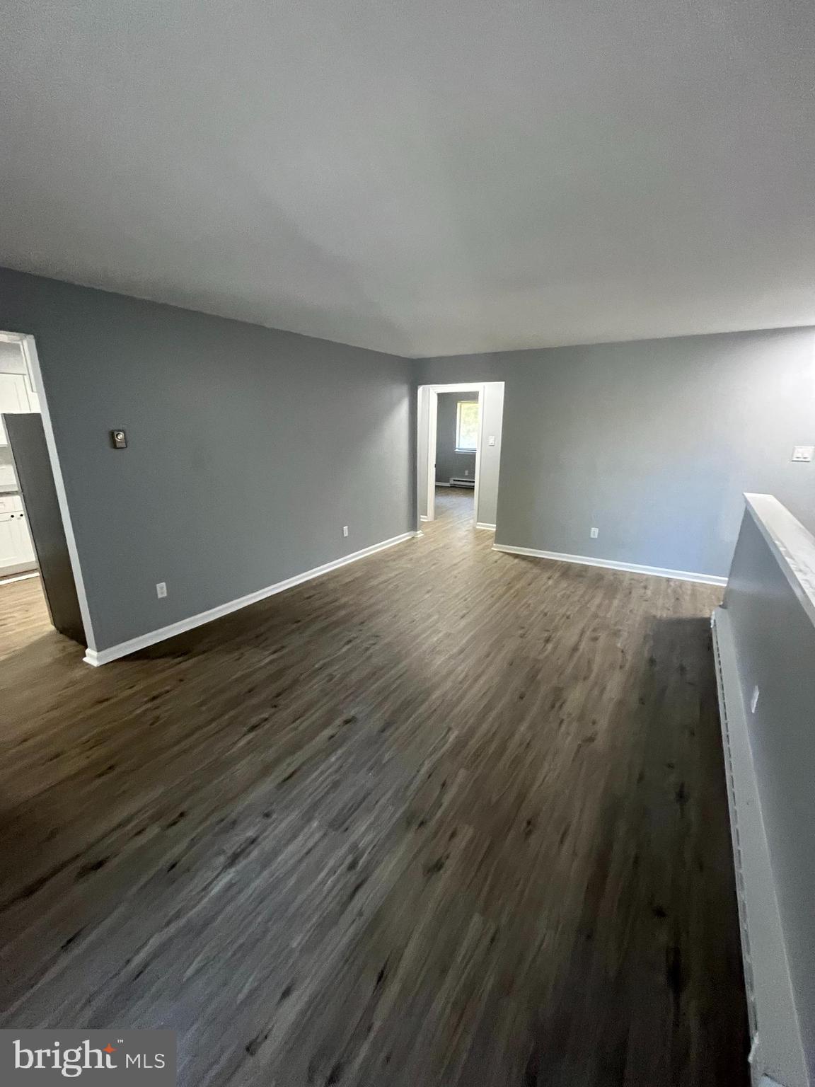 612 North Shady Retreat Road, Unit 14 Doylestown, PA 18901 - Photo 17 of 22 a view of an empty room with wooden floor and a window