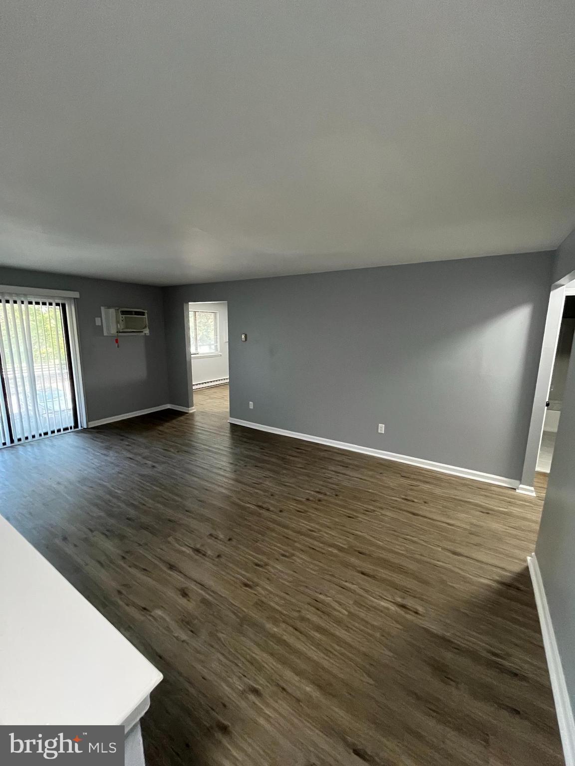 612 North Shady Retreat Road, Unit 14 Doylestown, PA 18901 - Photo 18 of 22 a view of an empty room with wooden floor and a window