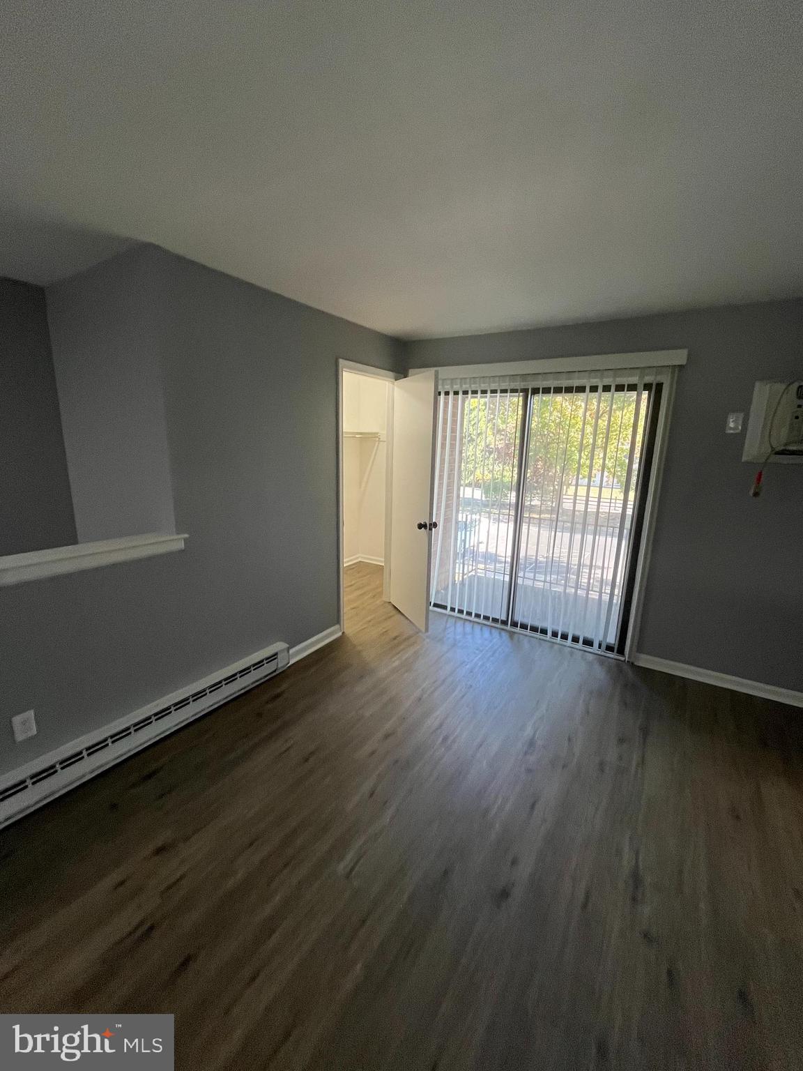 612 North Shady Retreat Road, Unit 14 Doylestown, PA 18901 - Photo 19 of 22 a view of an empty room with wooden floor and a window