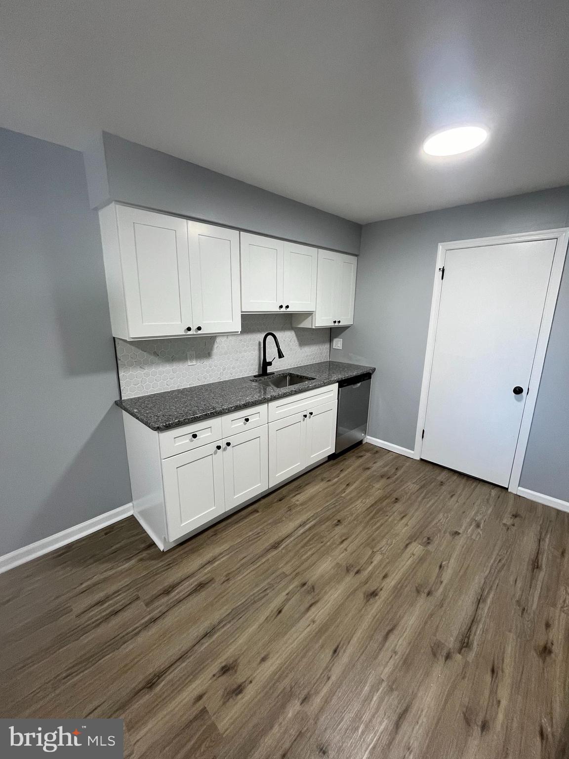 612 North Shady Retreat Road, Unit 14 Doylestown, PA 18901 - Photo 3 of 22 a kitchen with granite countertop a sink and cabinets