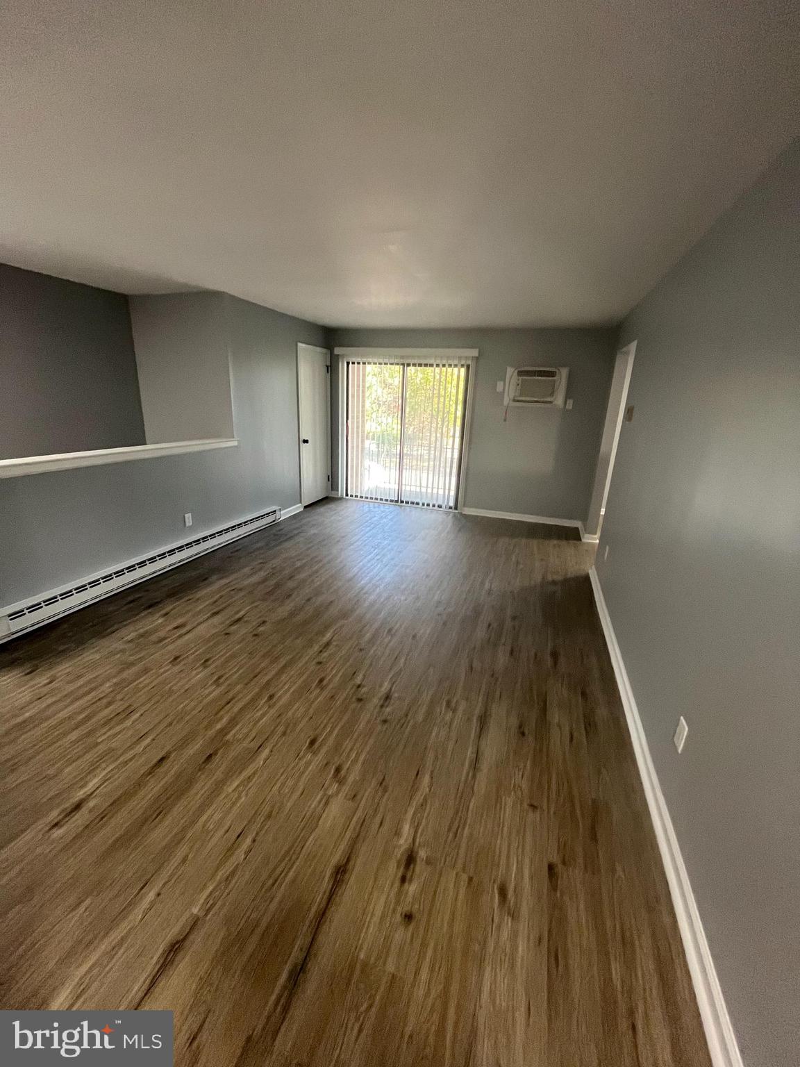 612 North Shady Retreat Road, Unit 14 Doylestown, PA 18901 - Photo 4 of 22 wooden floor in an empty room with a window