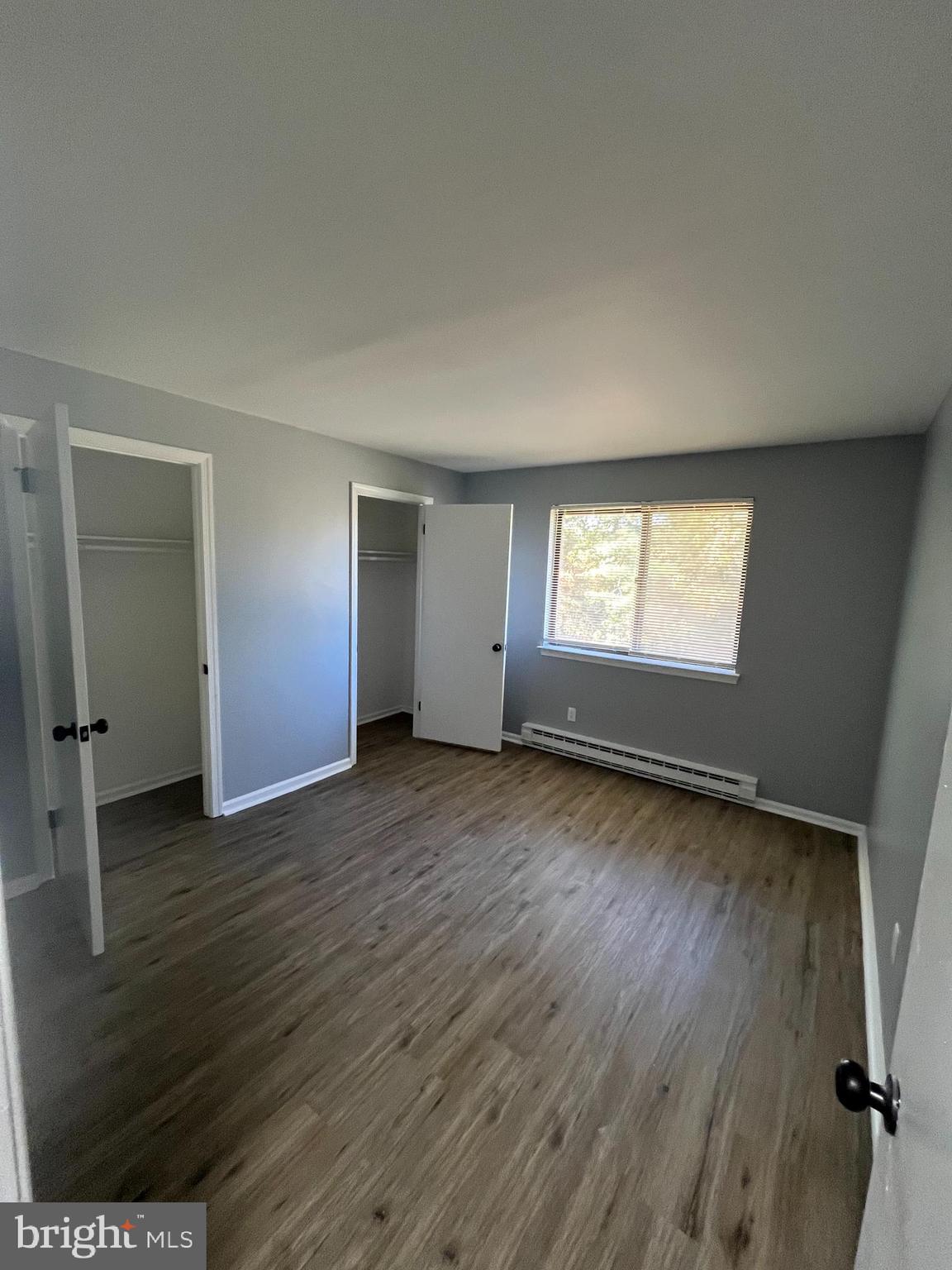 612 North Shady Retreat Road, Unit 14 Doylestown, PA 18901 - Photo 5 of 22 an empty room with wooden floor and window