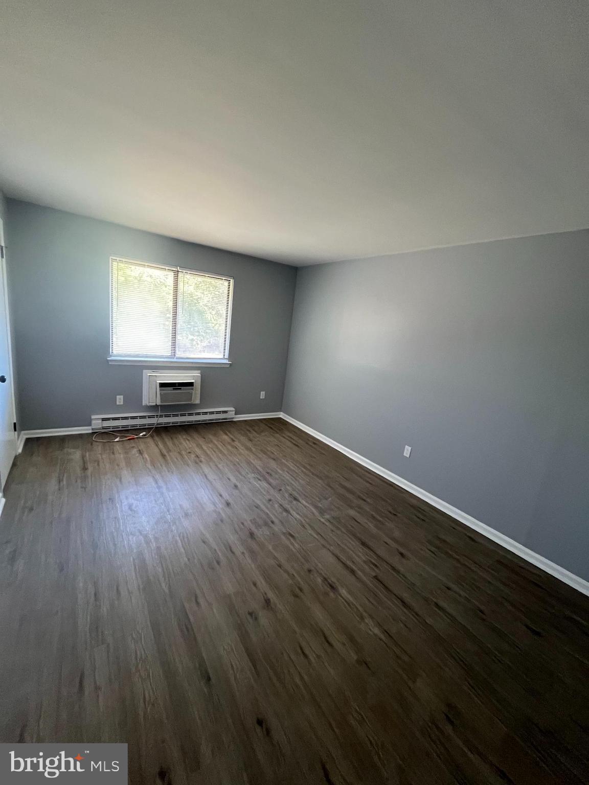 612 North Shady Retreat Road, Unit 14 Doylestown, PA 18901 - Photo 10 of 22 an empty room with wooden floor and windows