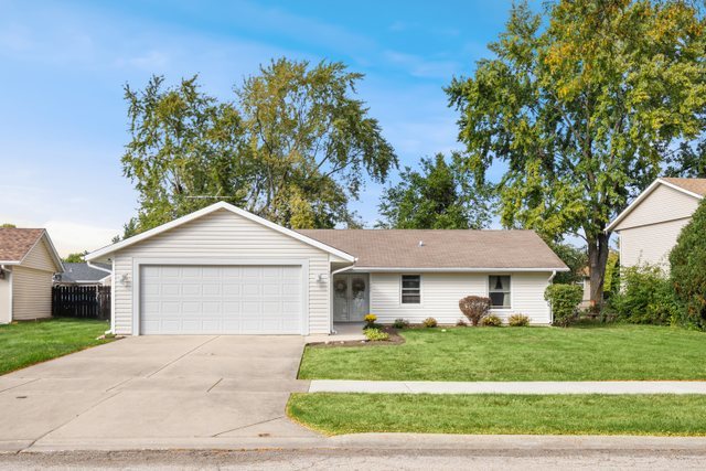 648 Springfield Court Roselle, IL 60172 - Photo 1 of 1 a front view of a house with a yard