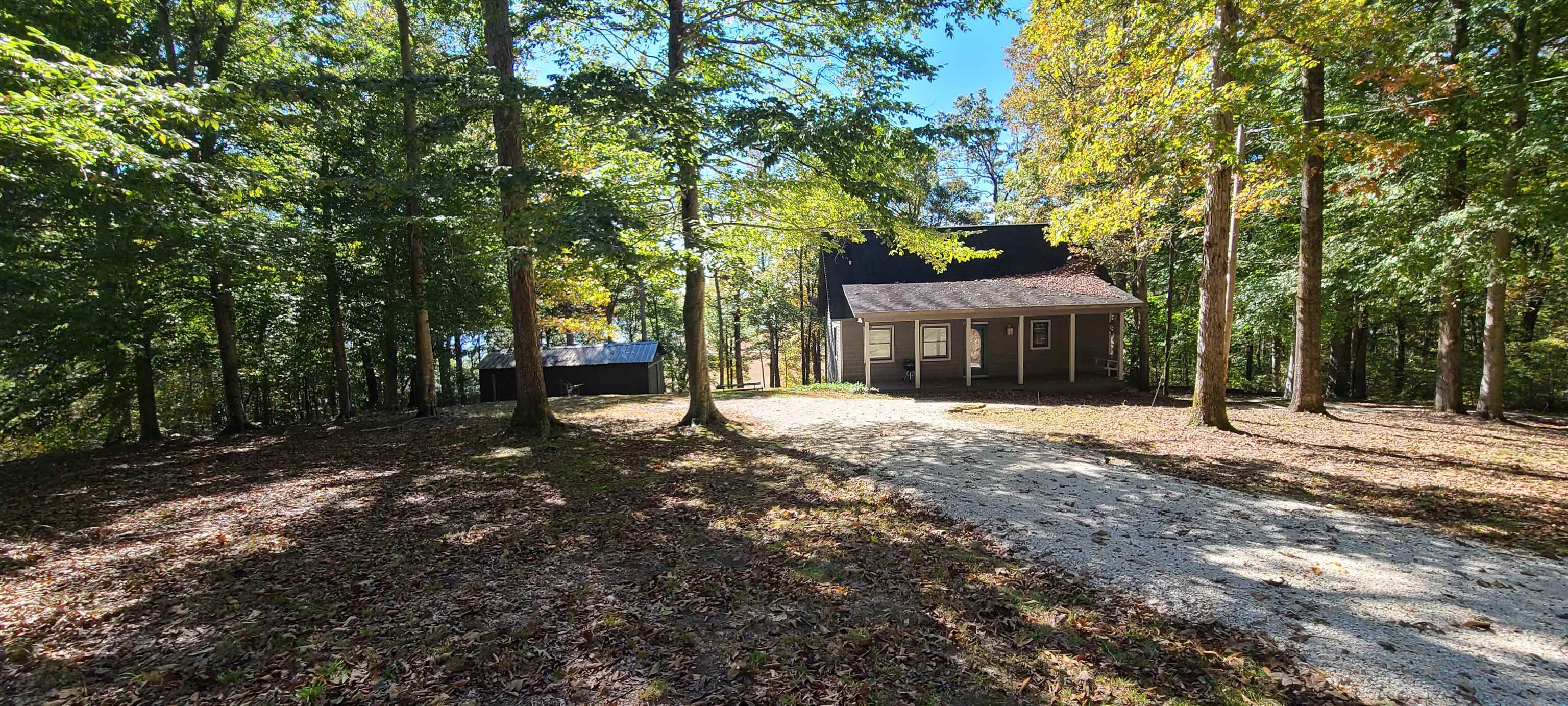 1548 Lakeview Manor Road Springville, TN 38256 - Photo 8 of 18 a front view of a house with a yard