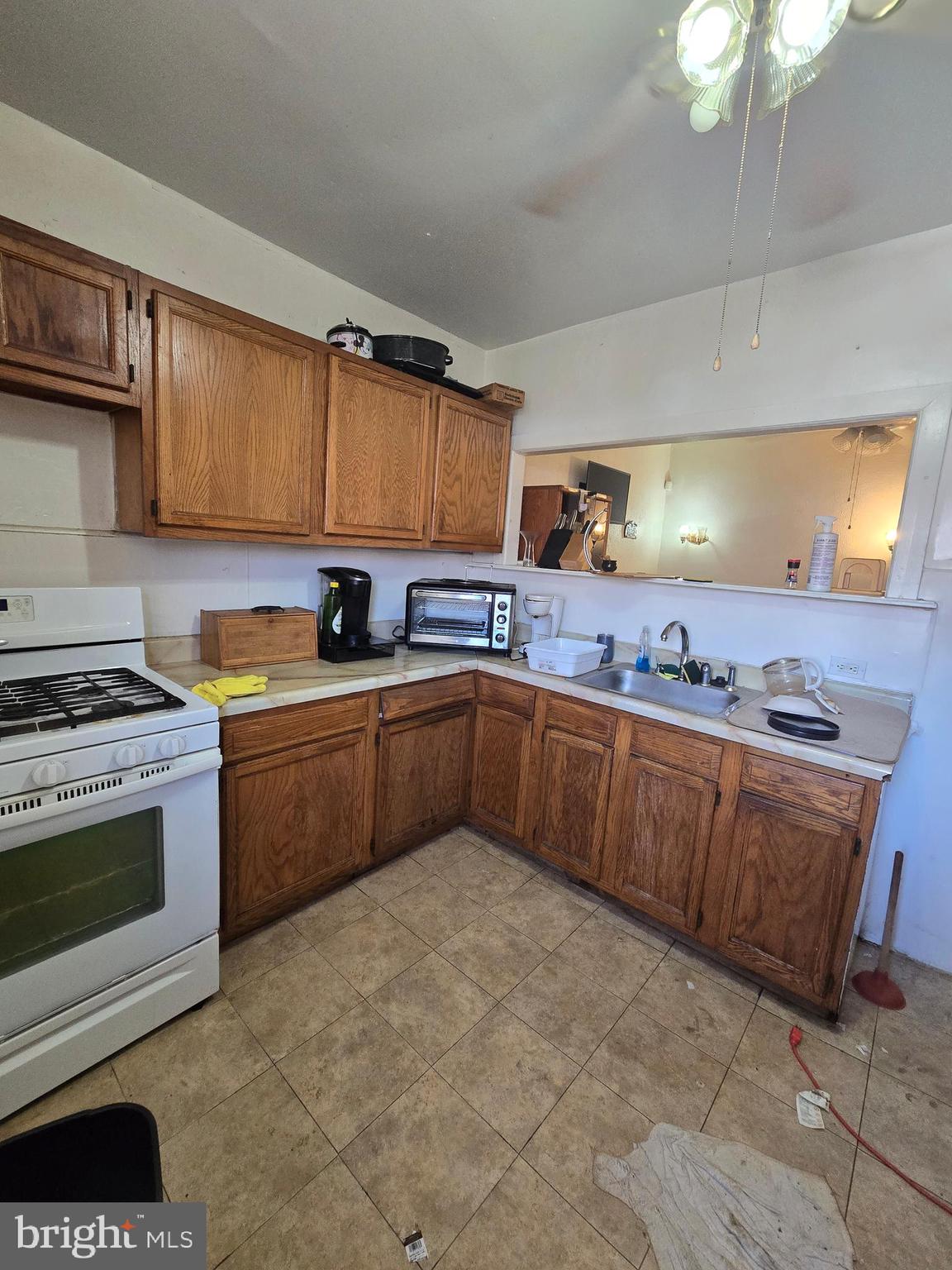 1959 Georgian Road Philadelphia, PA 19138 - Photo 13 of 29 a kitchen with stainless steel appliances granite countertop a stove sink and cabinets