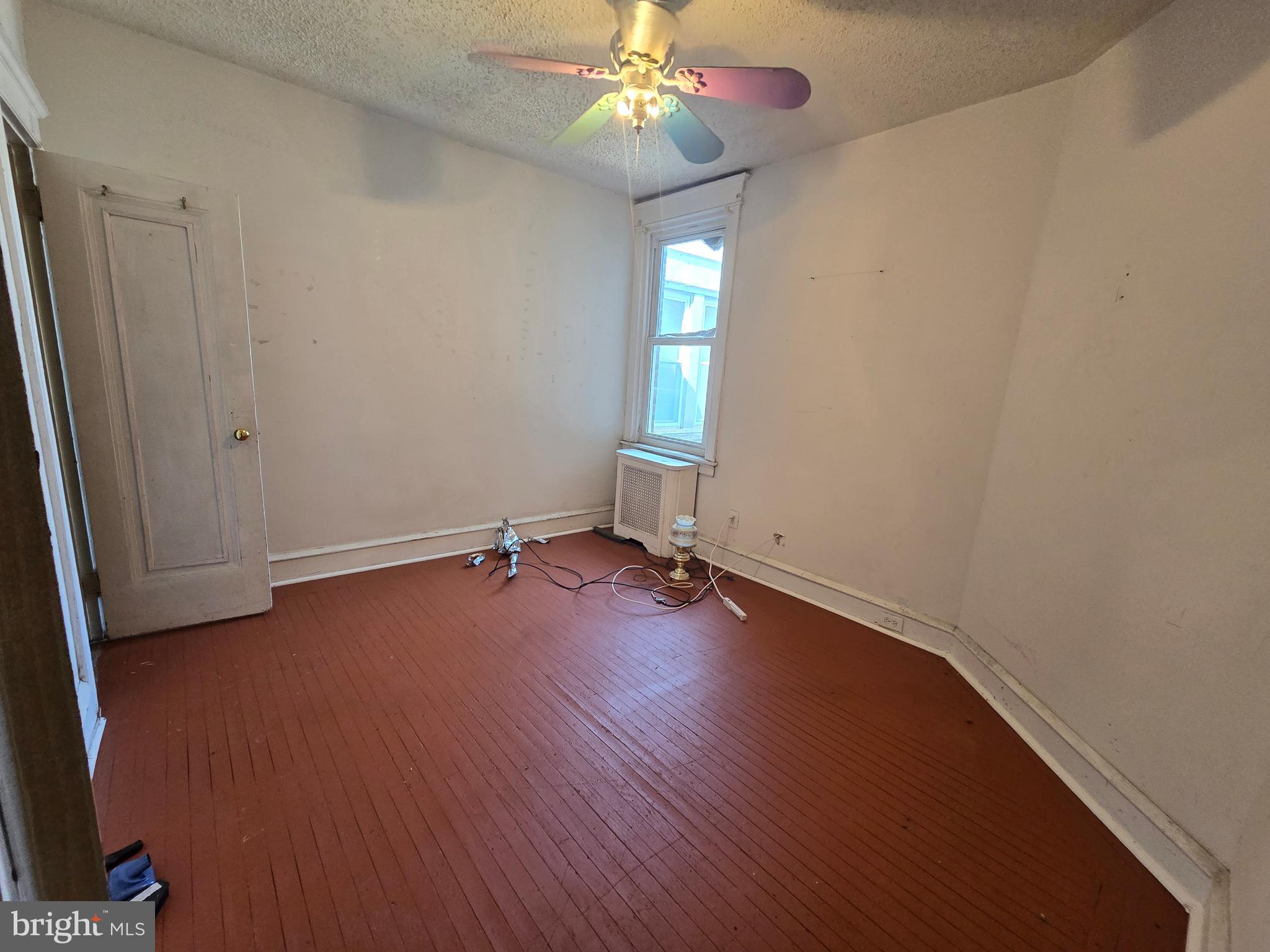 1959 Georgian Road Philadelphia, PA 19138 - Photo 25 of 29 an empty room with wooden floor fan and window