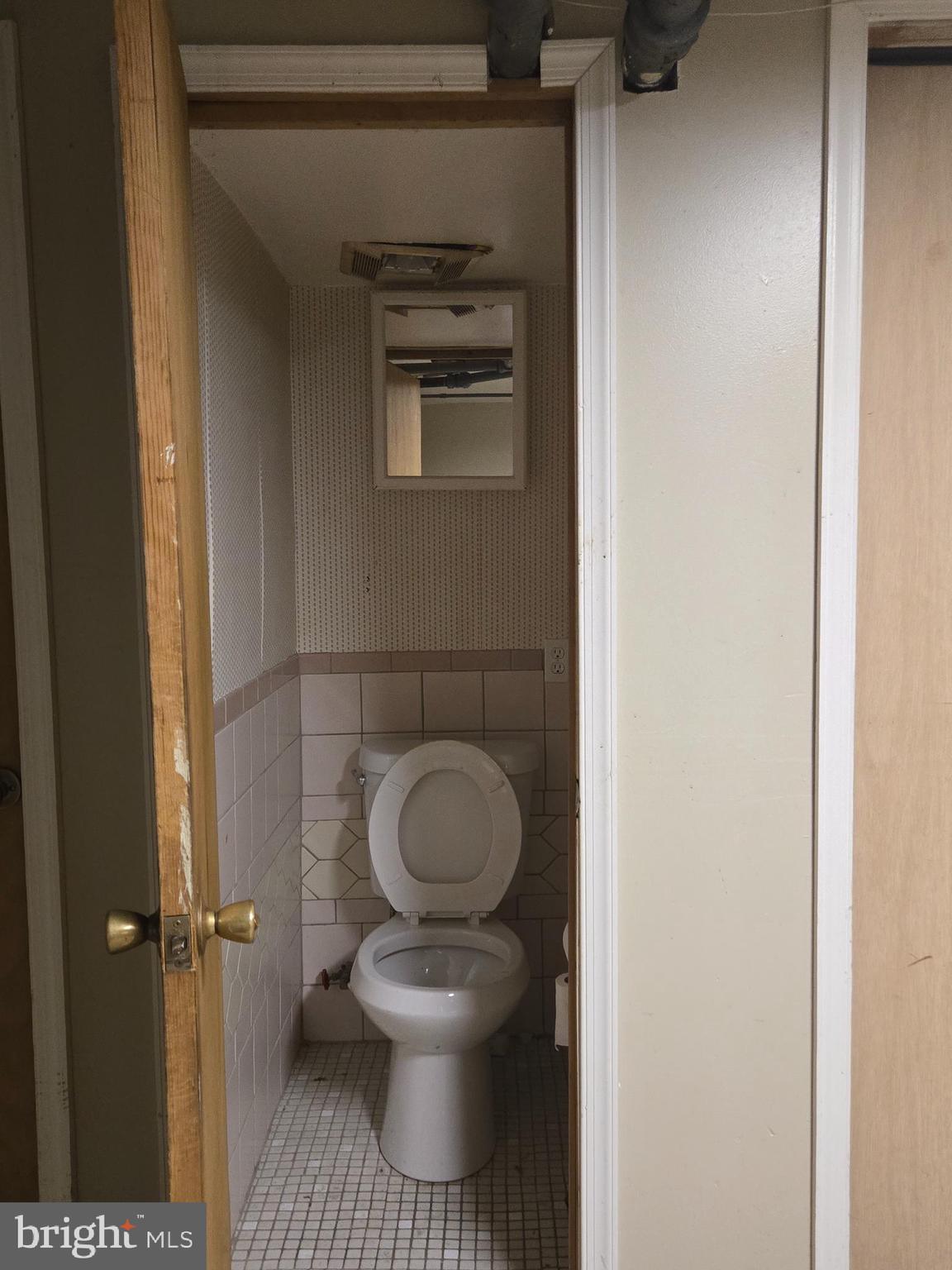 1959 Georgian Road Philadelphia, PA 19138 - Photo 27 of 29 a bathroom with a toilet and a vanity