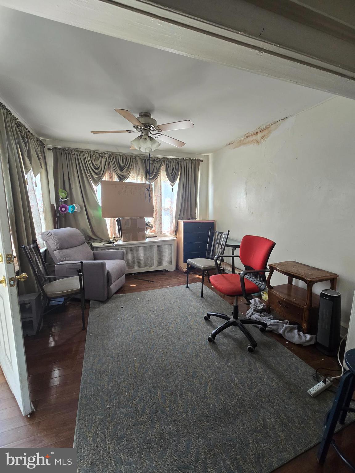 1959 Georgian Road Philadelphia, PA 19138 - Photo 6 of 29 a living room with furniture a flat screen tv and a window