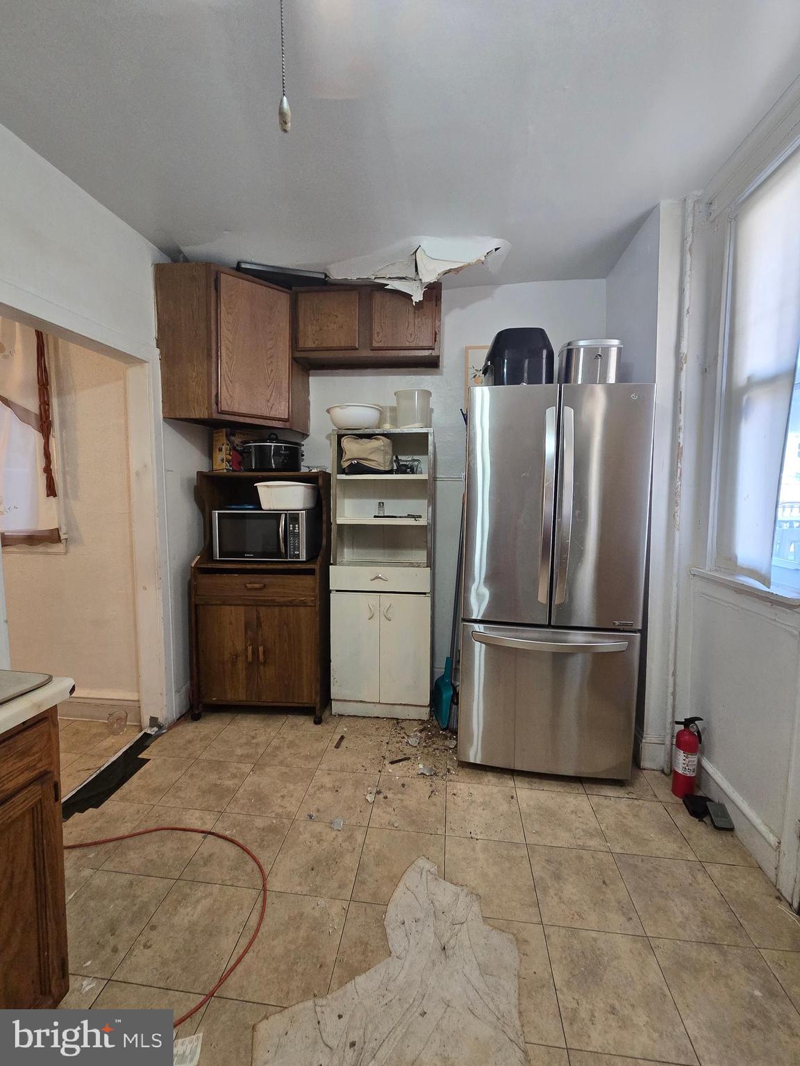 1959 Georgian Road Philadelphia, PA 19138 - Photo 10 of 29 a kitchen with stainless steel appliances granite countertop a refrigerator stove and sink