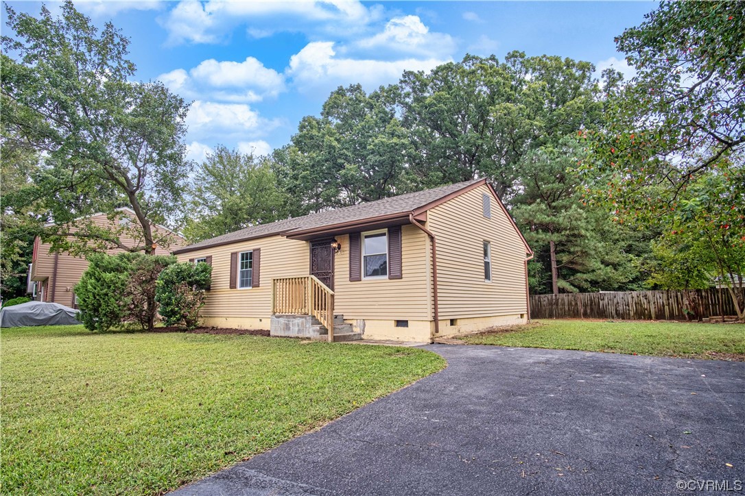 2307 Crosscreek Road Richmond, VA 23223 - Photo 2 of 14 a view of a house with yard and a garden
