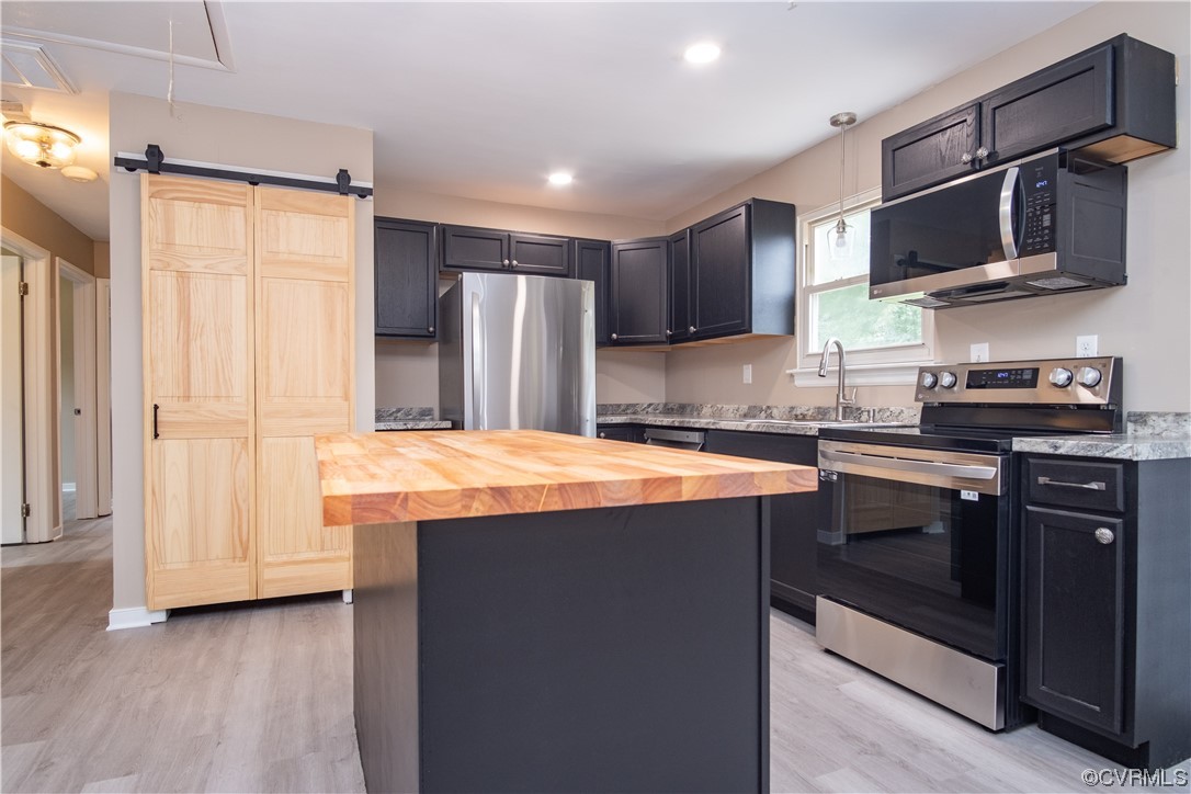 2307 Crosscreek Road Richmond, VA 23223 - Photo 6 of 14 a kitchen with stainless steel appliances granite countertop a refrigerator a stove top oven a sink and dishwasher