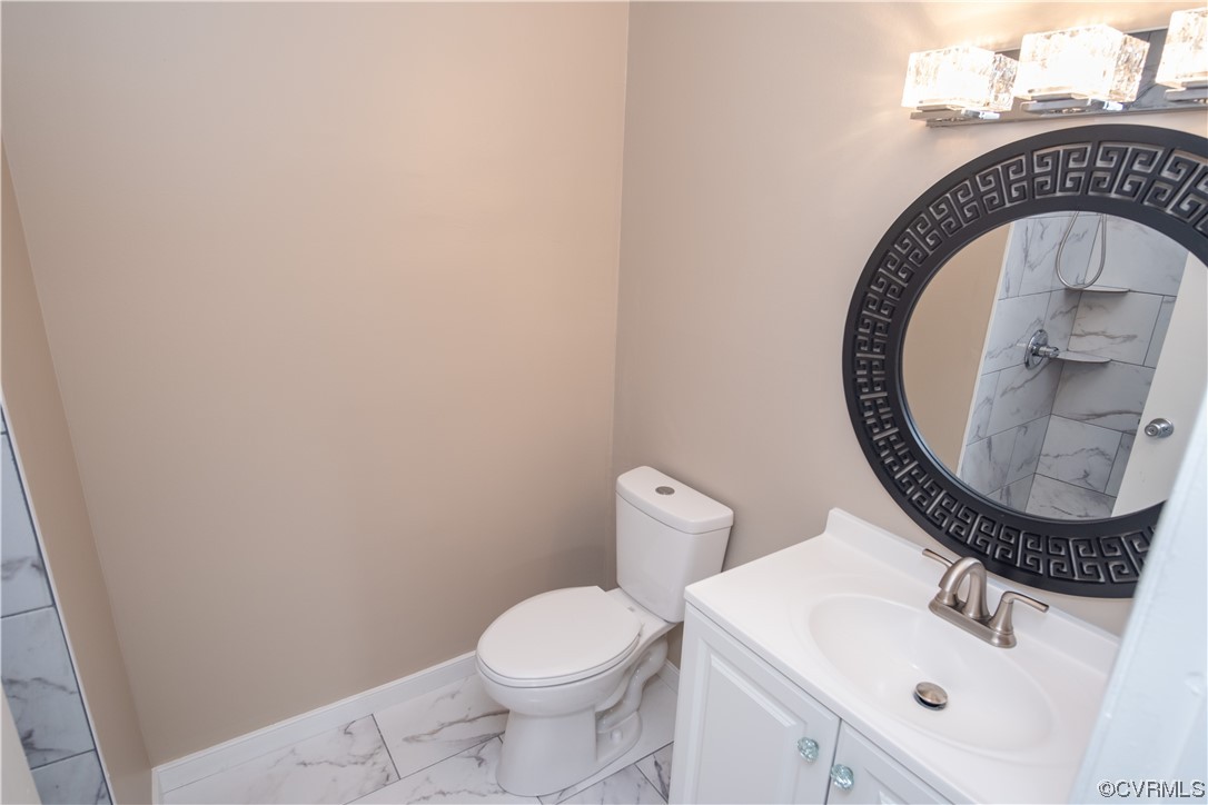 2307 Crosscreek Road Richmond, VA 23223 - Photo 10 of 14 a bathroom with a sink and a mirror