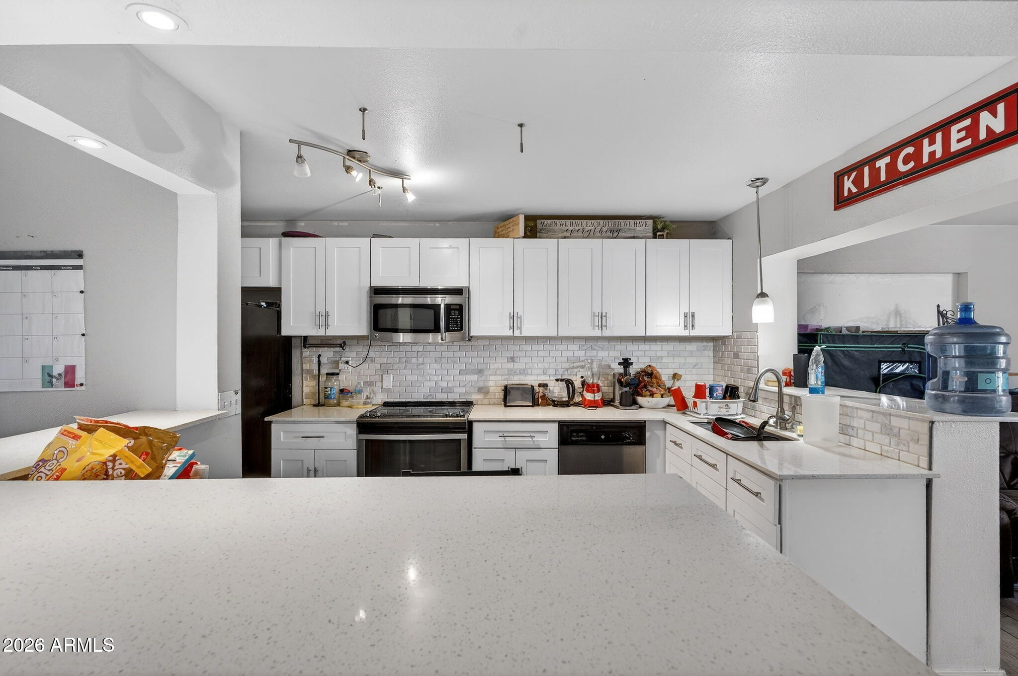 2222 West Flower Street Phoenix, AZ 85015 - Photo 16 of 36 a kitchen with counter top space cabinets and stainless steel appliances
