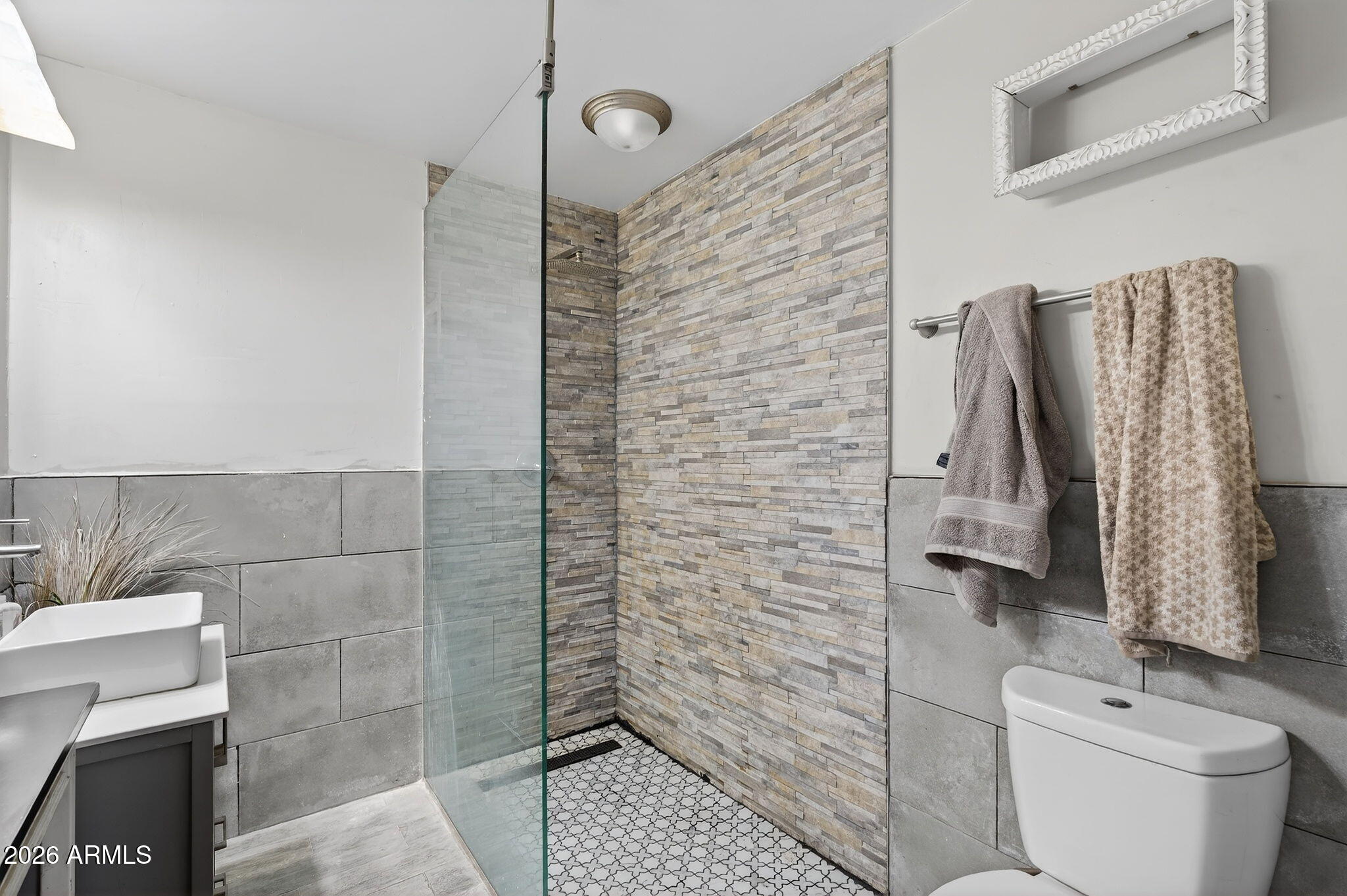 2222 West Flower Street Phoenix, AZ 85015 - Photo 21 of 36 a bathroom with a toilet and a shower