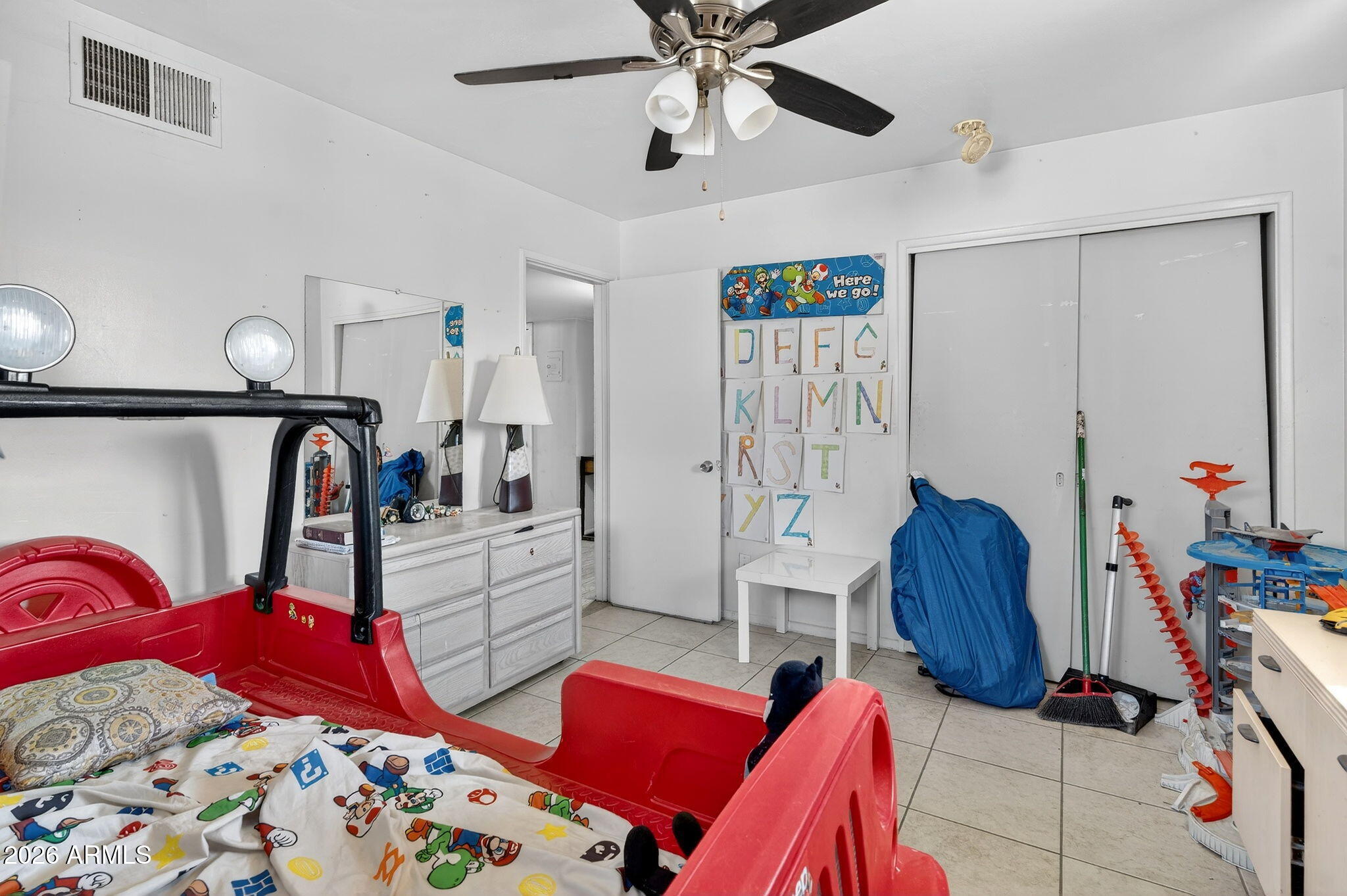 2222 West Flower Street Phoenix, AZ 85015 - Photo 24 of 36 a bedroom with bed and a chandelier