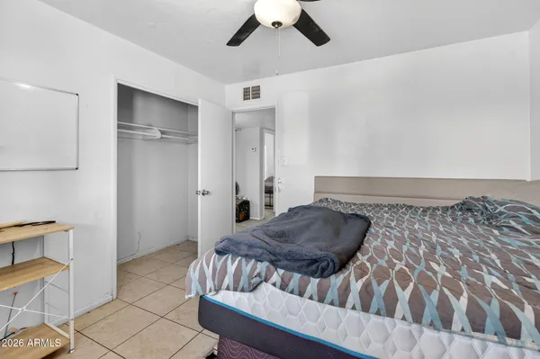 a living room with a couch and a chandelier
