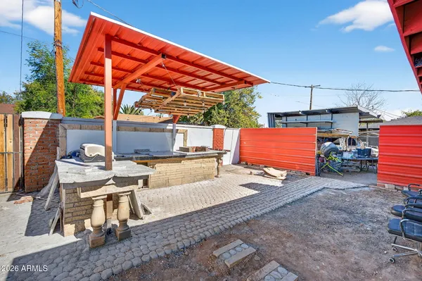 a view of backyard with outdoor seating