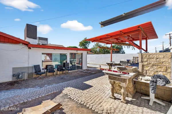 a view of a chairs and table in a patio