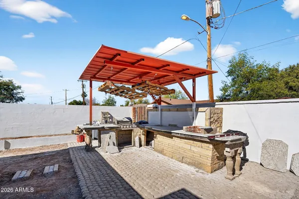 a view of a tables and chairs in patio