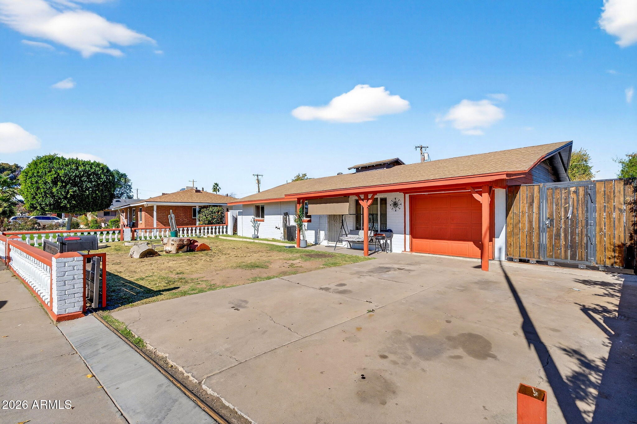 2222 West Flower Street Phoenix, AZ 85015 - Photo 3 of 36 a front view of a house with a yard