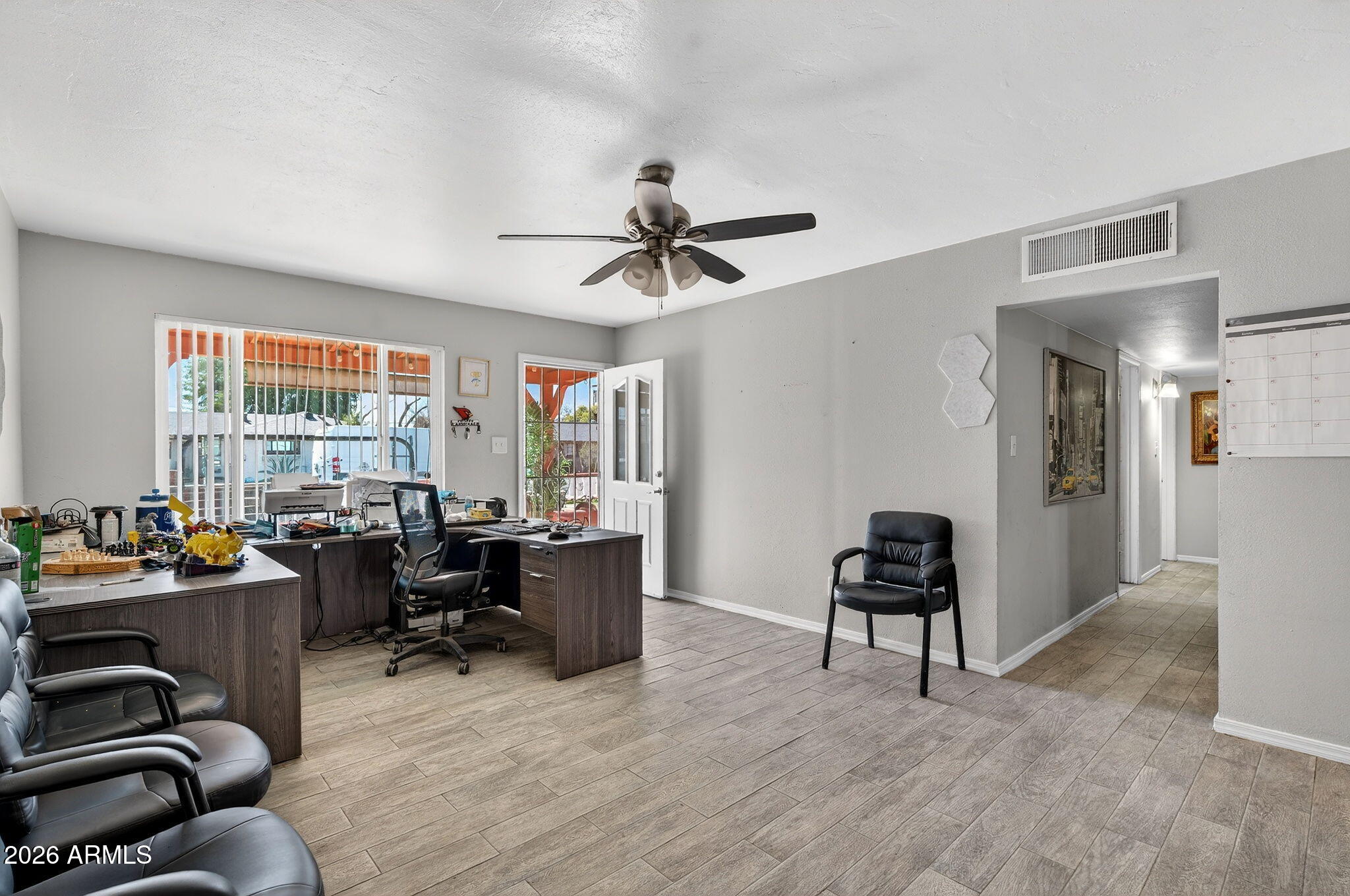 2222 West Flower Street Phoenix, AZ 85015 - Photo 5 of 36 a view of a livingroom with workspace and a window