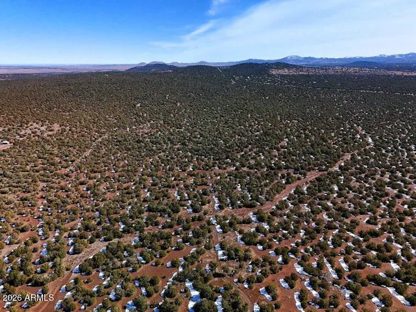 an aerial view of beach and city