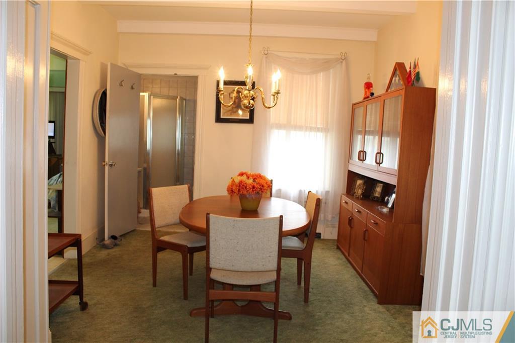 142 Rector Street Perth Amboy, NJ 08861 - Photo 6 of 22 a dining room with furniture and window