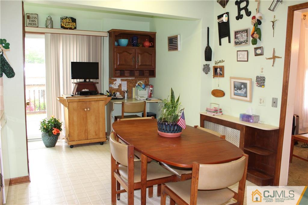 142 Rector Street Perth Amboy, NJ 08861 - Photo 9 of 22 a dining room with furniture and wooden floor