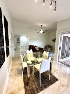 a view of a dining room with furniture