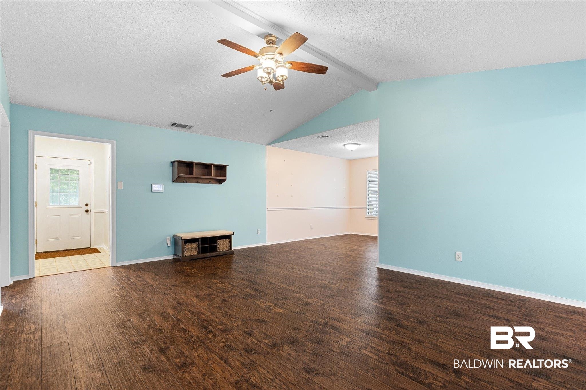 5645 Green Tree Road Mobile, AL 36609 - Photo 3 of 30 Unfurnished living room with a ceiling fan, wood finished floors, and baseboards