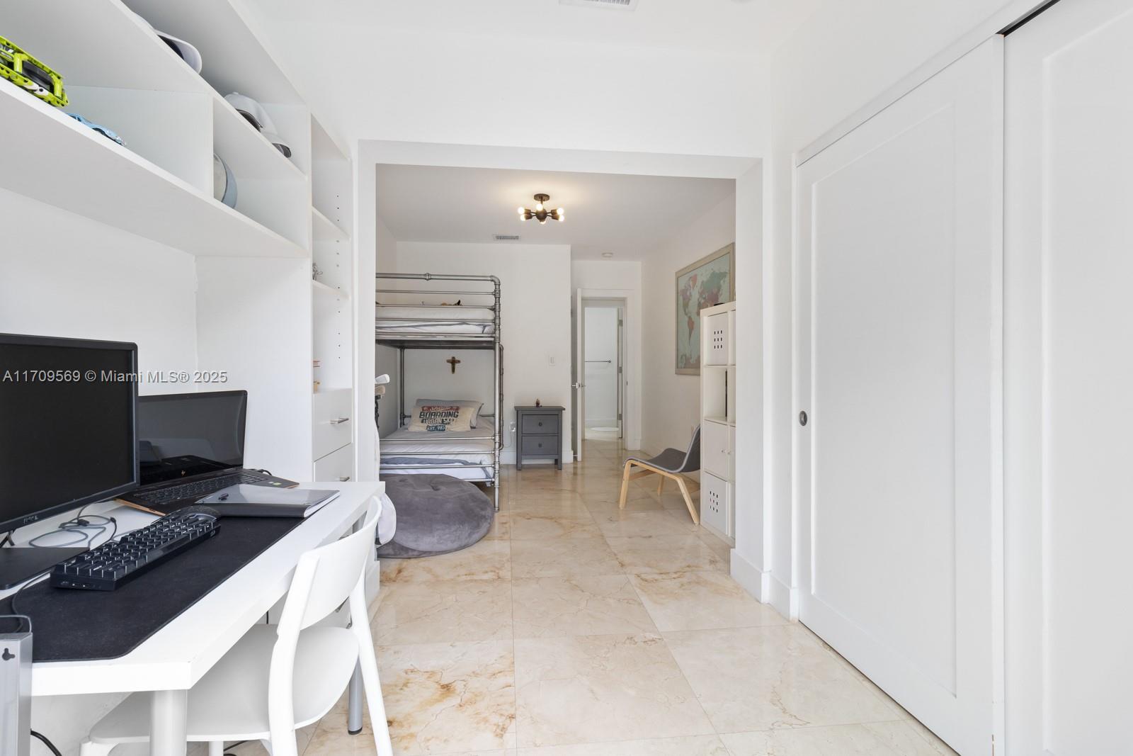 140 West Mashta Drive Key Biscayne, FL 33149 - Photo 14 of 35 a kitchen with a refrigerator and a stove top oven