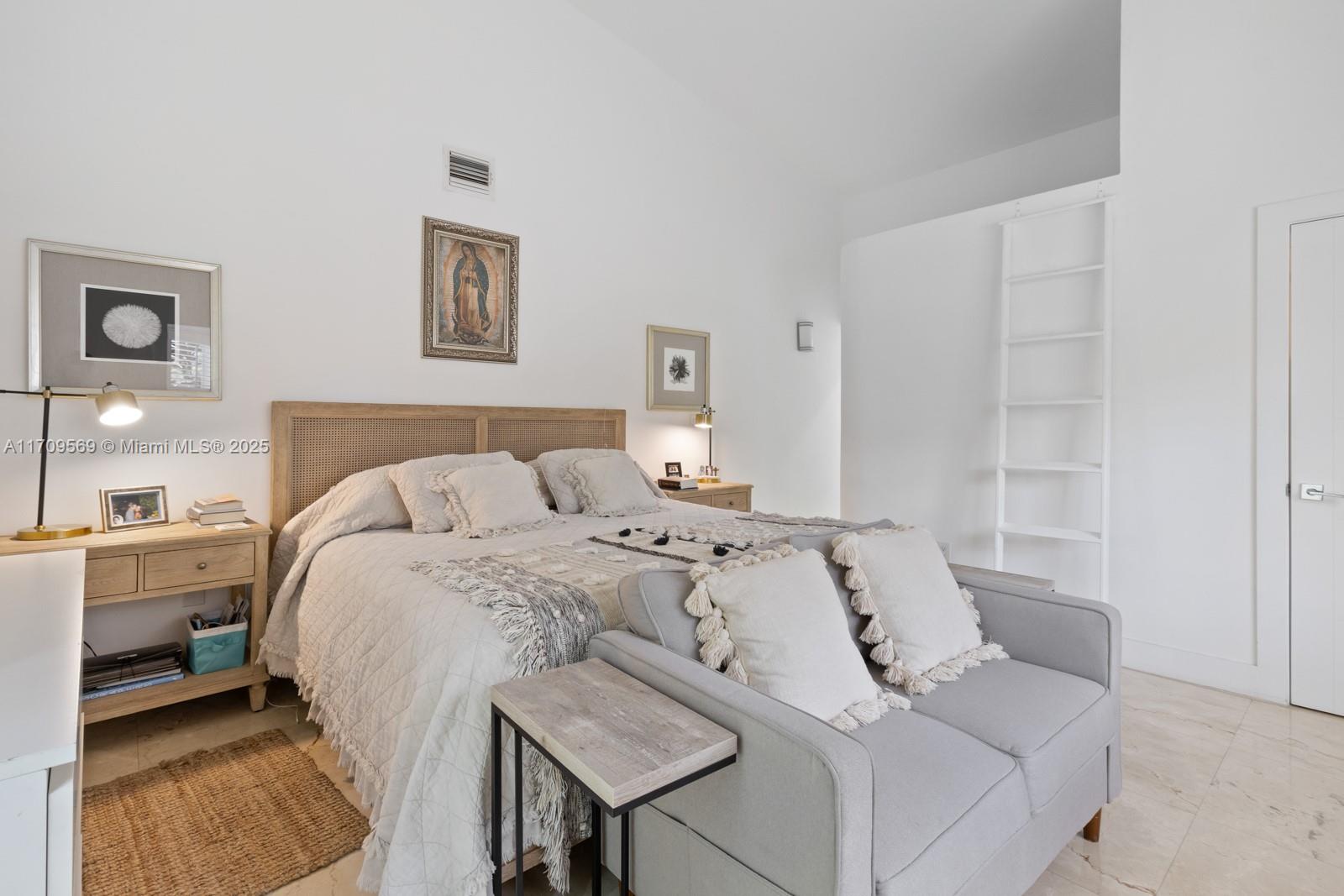 140 West Mashta Drive Key Biscayne, FL 33149 - Photo 16 of 35 a bed sitting in a bedroom and view of living room