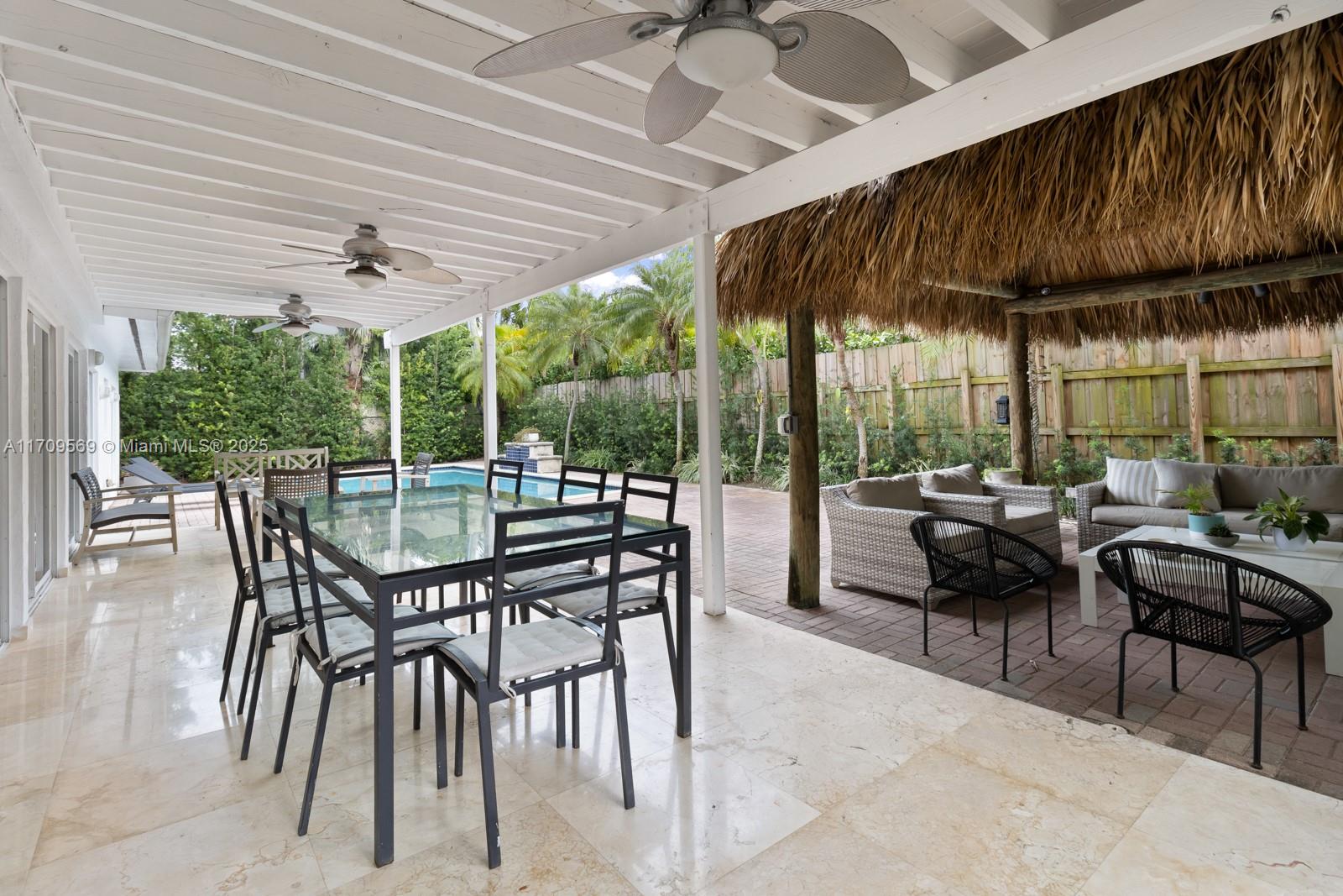 140 West Mashta Drive Key Biscayne, FL 33149 - Photo 18 of 35 a outdoor dining space with furniture and outdoor view