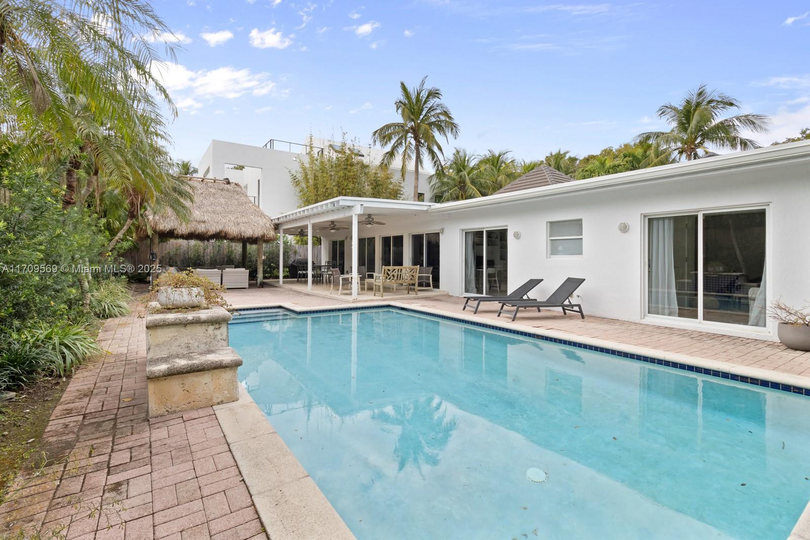 140 West Mashta Drive Key Biscayne, FL 33149 - Photo 22 of 35 a view of a house with pool