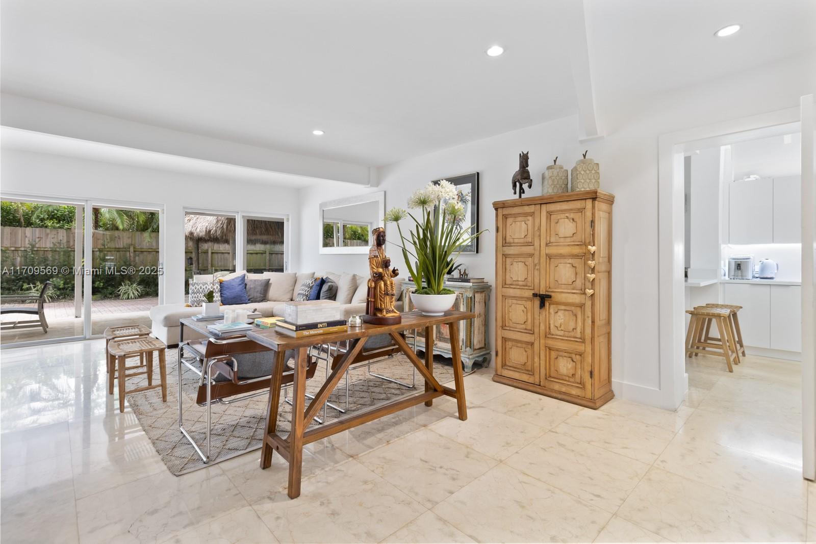 140 West Mashta Drive Key Biscayne, FL 33149 - Photo 30 of 35 a view of a livingroom with furniture and a table