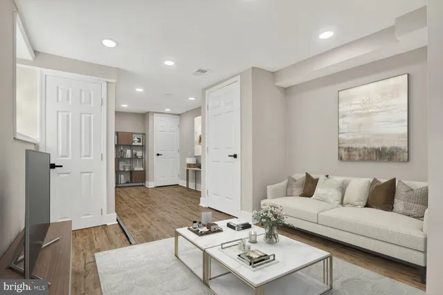 a living room with furniture and a table