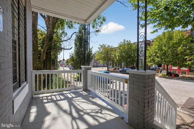 a view of a street with a large window