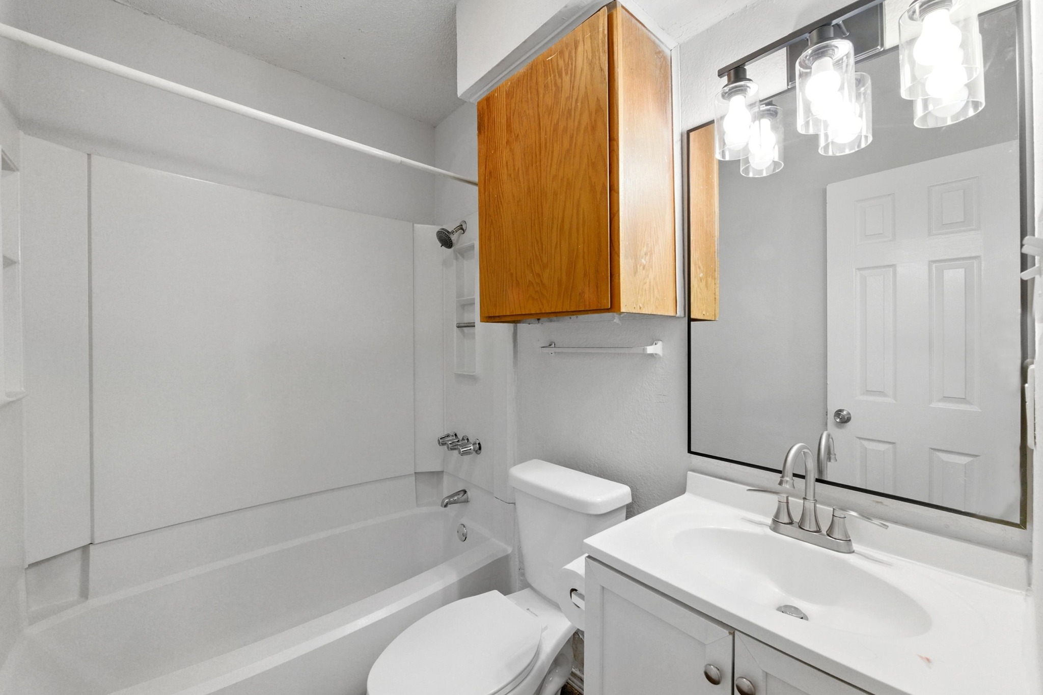 5707 Spring Meadow Road Austin, TX 78744 - Photo 19 of 21 a bathroom with a sink toilet and shower