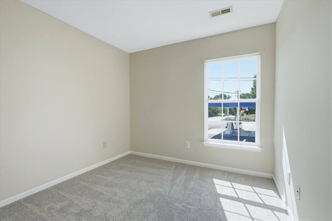 703 Bellview Way Seneca, SC 29678 - Photo 13 of 23 Soft carpeting pairs with a multi-pane window to create a quiet, comfortable space.