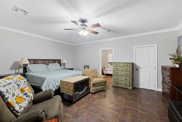 a bedroom with bed and furniture